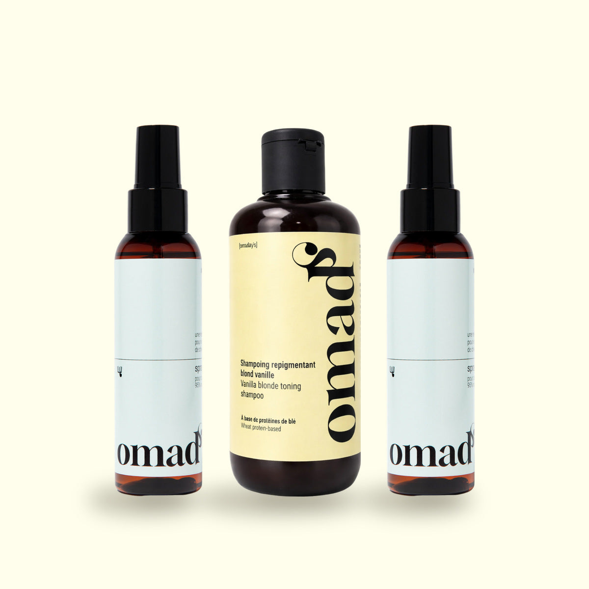Deux sprays éclaircissants encadrant le shampoing Blond Vanille OMAD'S